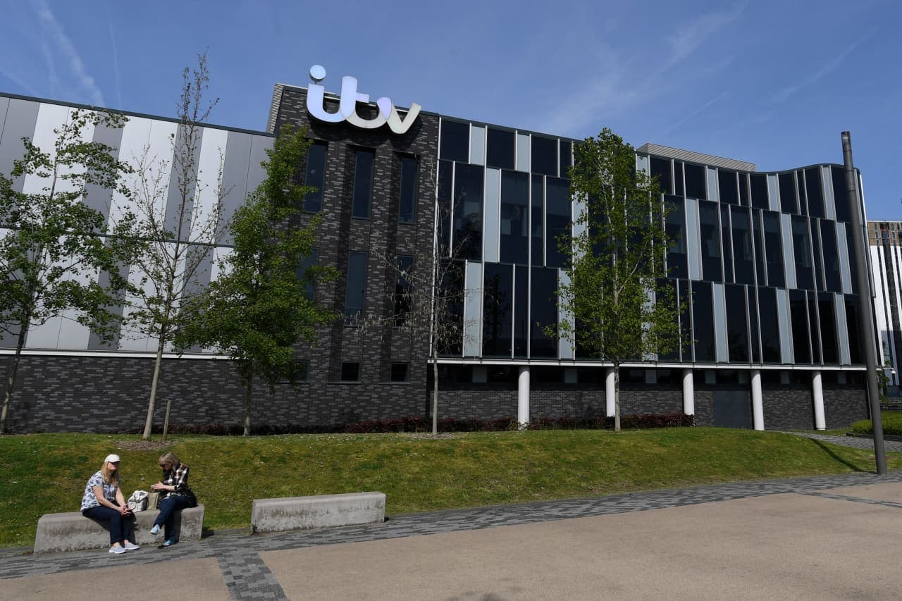Just a week after spin-off plan, Comcast says it will buy British broadcaster