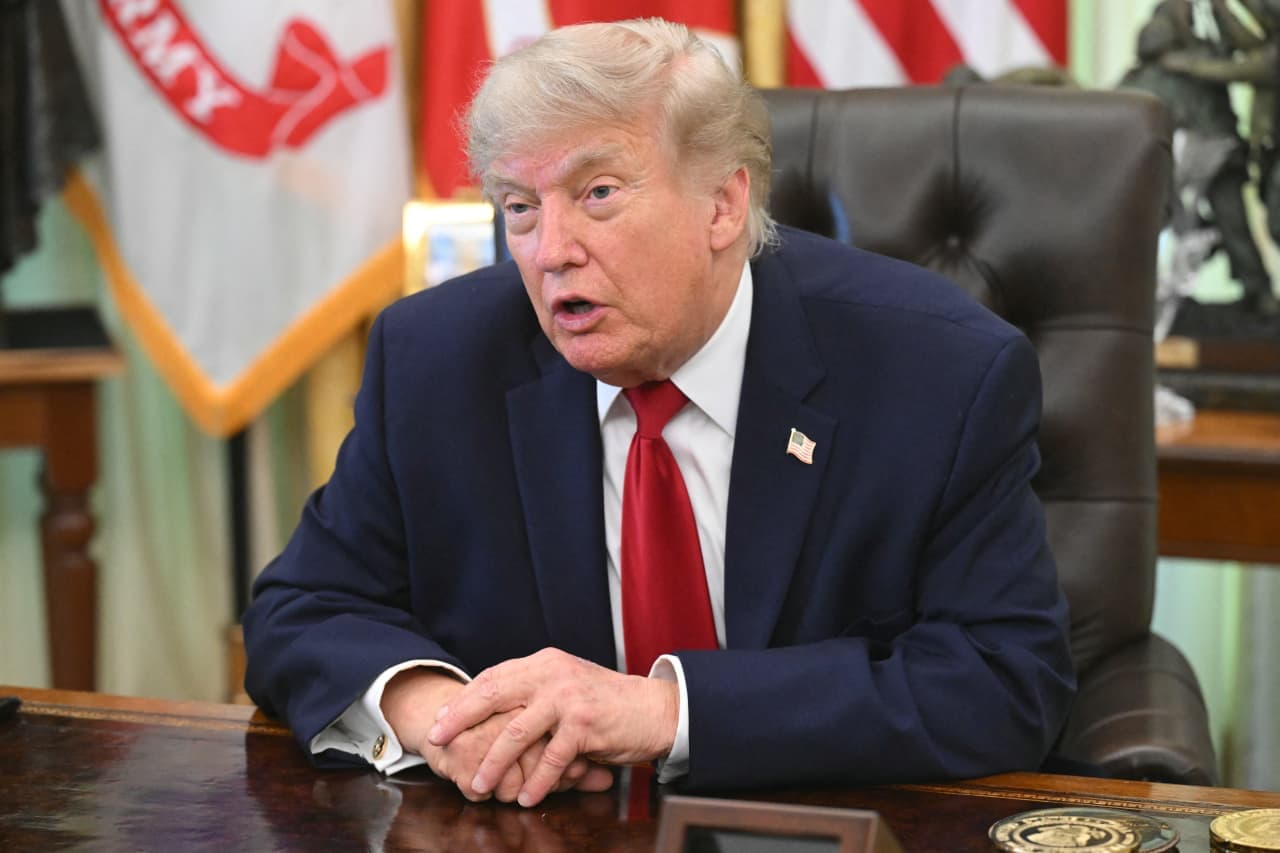 Trump rings Wall Street opening bells and says the stock market ‘is going to go through the roof’